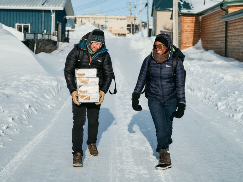 Eric walks with women in snow